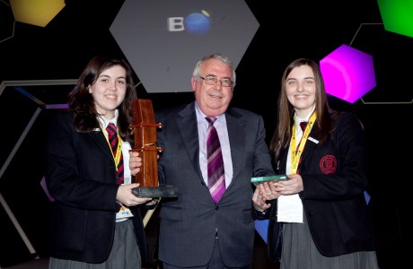 Minister for Trade and Development Joe Costello presents the Irish Aid special 'Science for Development' award to two Ballyclare High School students from Antrim at the BT Young Scientist and Technology Exhibition.